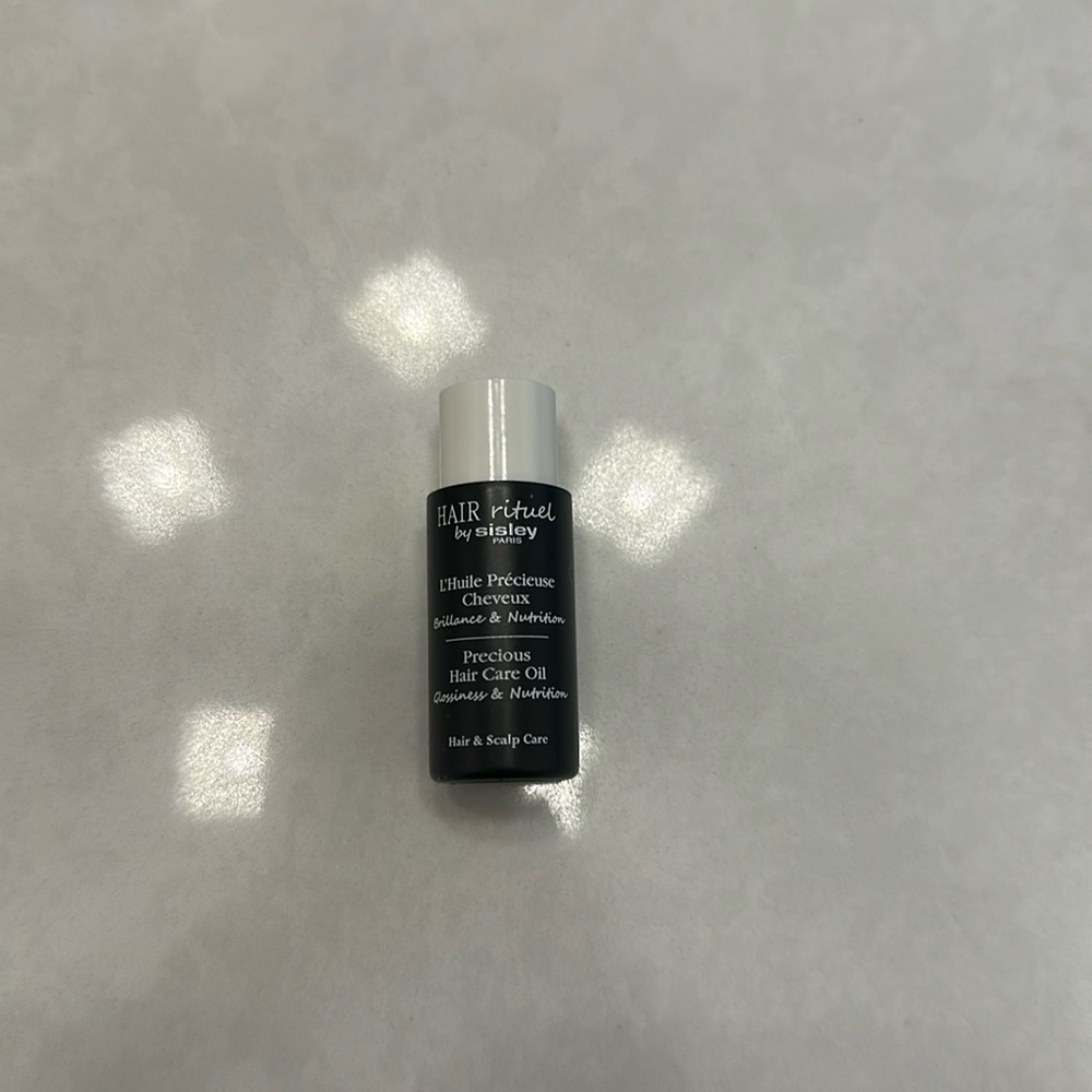 New/ unused. Hair Ritual by Sisley Paris. Precious Hair Care Oil. 10 mL.